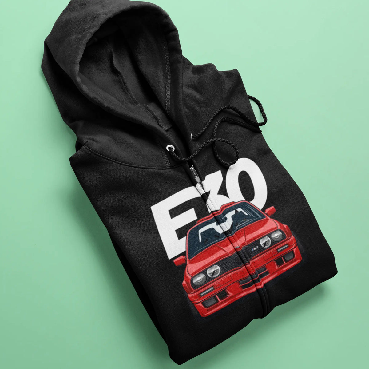 Black full-zip hooded sweatshirt featuring a detailed graphic drawing of a legendary BMW. — Μαύρη ζακέτα φούτερ με κουκούλα που φέρει λεπτομερές γραφικό σχέδιο μιας θρυλικής BMW.