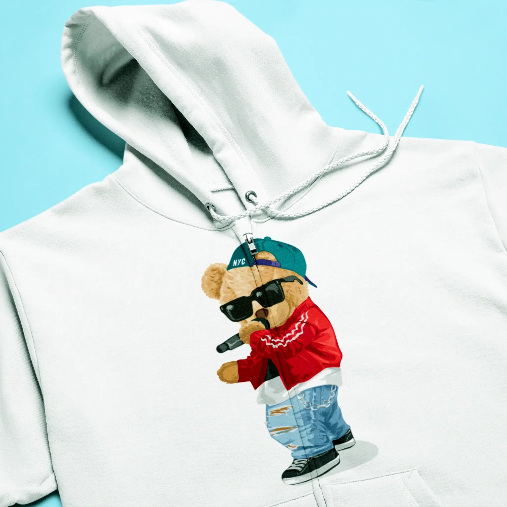 A stylish white zip-up hoodie with a teddy bear immersed in hip-hop vibes, προσθέτοντας ρυθμό στην καθημερινότητά σου