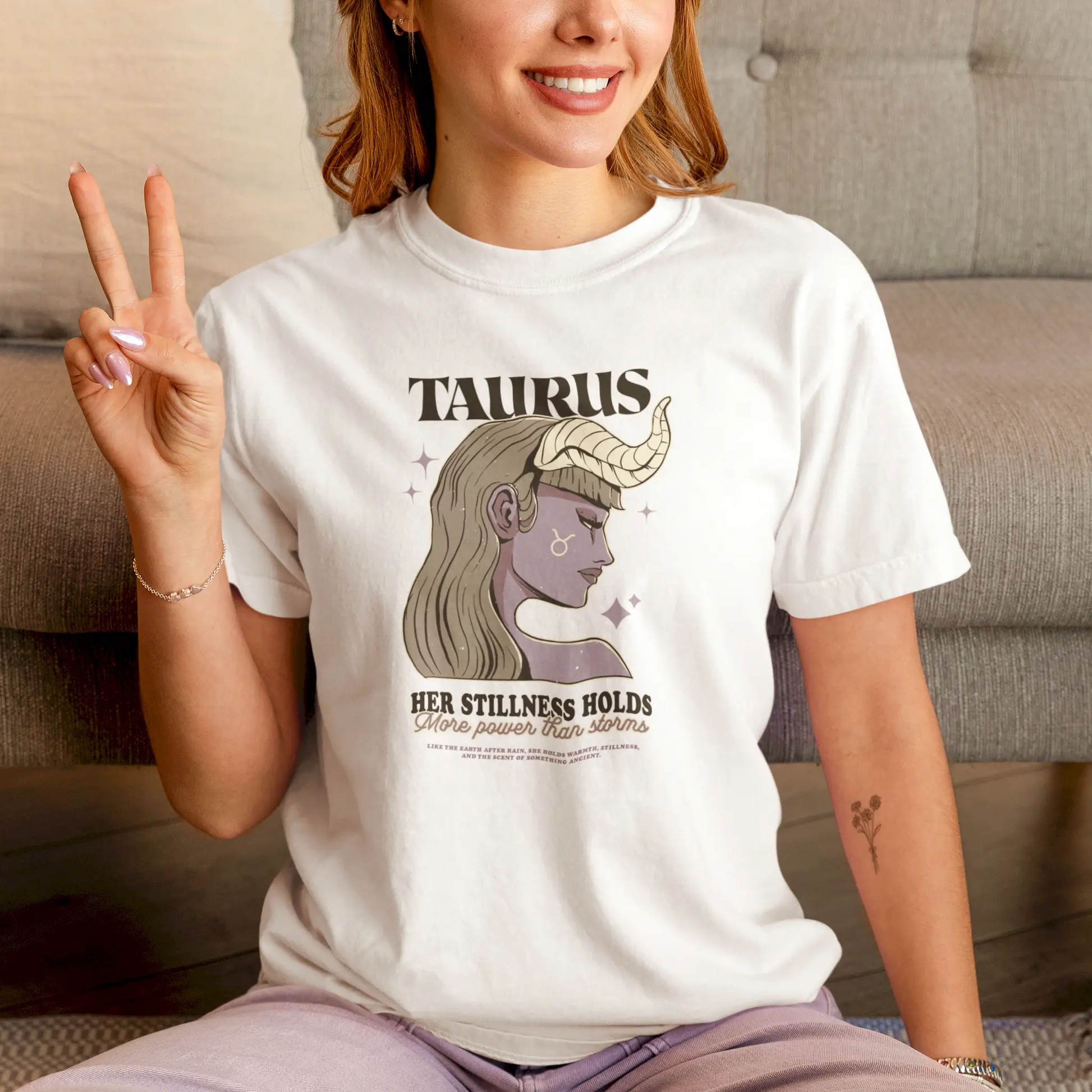 A white t-shirt featuring a mystical Taurus woman with horns and zodiac symbol, radiating calm strength – Λευκό μπλουζάκι με μυστικιστική Ταυρίνα με κέρατα και το ζώδιο, που αποπνέει ήρεμη δύναμη.