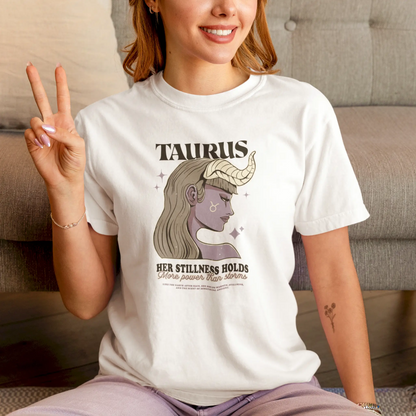 A white t-shirt featuring a mystical Taurus woman with horns and zodiac symbol, radiating calm strength – Λευκό μπλουζάκι με μυστικιστική Ταυρίνα με κέρατα και το ζώδιο, που αποπνέει ήρεμη δύναμη.