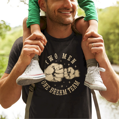 Black T-shirt with bold white print: "The Men – One Dream" – a motivational father-son matching set / Μαύρο μπλουζάκι με λευκή εκτύπωση: "The Men – One Dream", ιδανικό για ταιριαστό σετ πατέρα και γιου.