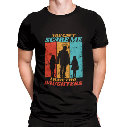 Black T-shirt with bold white print: "You Can't Scare Me – I Have Two Daughters" – a powerful statement for proud dads / Μαύρο μπλουζάκι με λευκή εκτύπωση: "Δεν με τρομάζεις – έχω δύο κόρες", ιδανικό για περήφανους πατέρες.