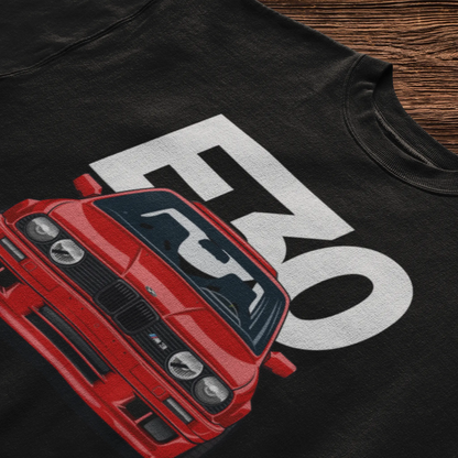 Black casual t-shirt with a detailed graphic print of a classic red BMW E30 M3 and bold lettering. — Μαύρο καθημερινό t-shirt με λεπτομερές γραφικό τύπωμα μιας κλασικής κόκκινης BMW E30 M3 και έντονα γράμματα