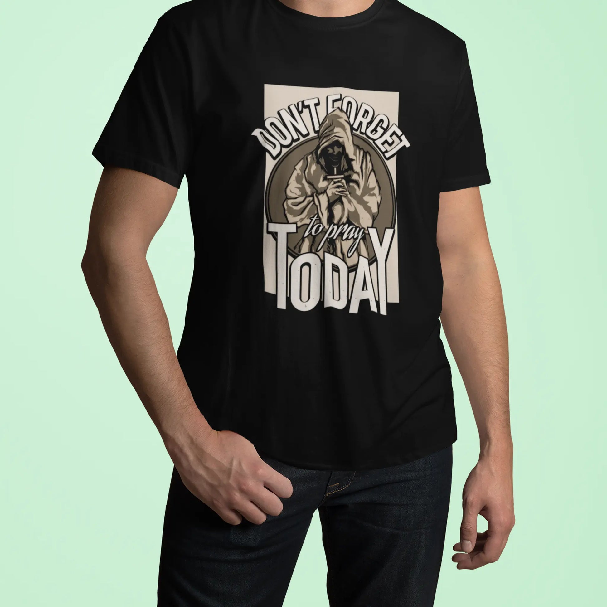 Black cotton top highlighting the detailed t-shirt print of a praying figure. — Μαύρο βαμβακερό μπλουζάκι που αναδεικνύει το λεπτομερές τύπωμα μιας φιγούρας που προσεύχεται