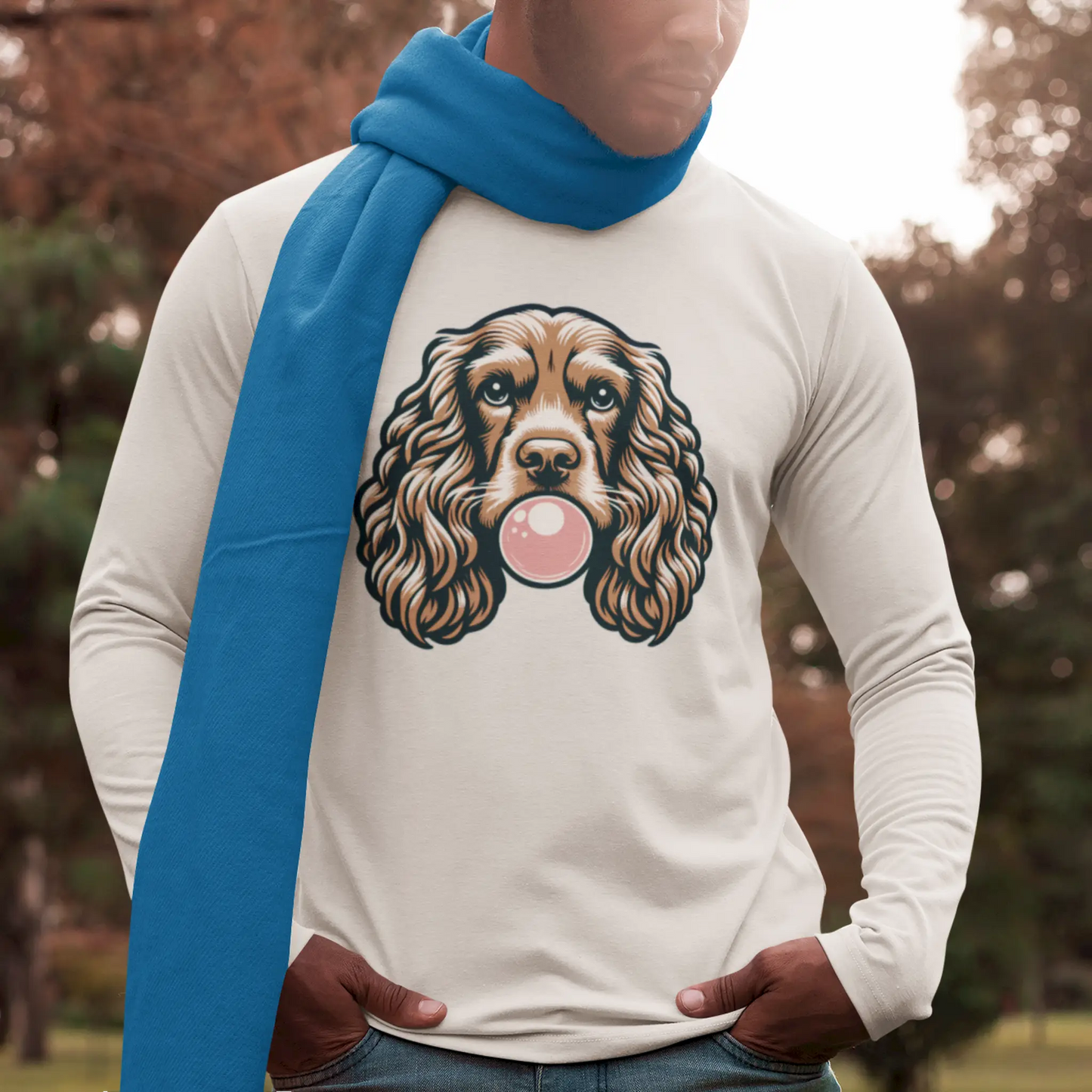 Playful spaniel showcases bubblegum talent on your white long sleeve shirt. Ο παιχνιδιάρης σπάνιελ επιδεικνύει το ταλέντο του στην τσίχλα στη λευκή μακρυμάνικη σου μπλούζα