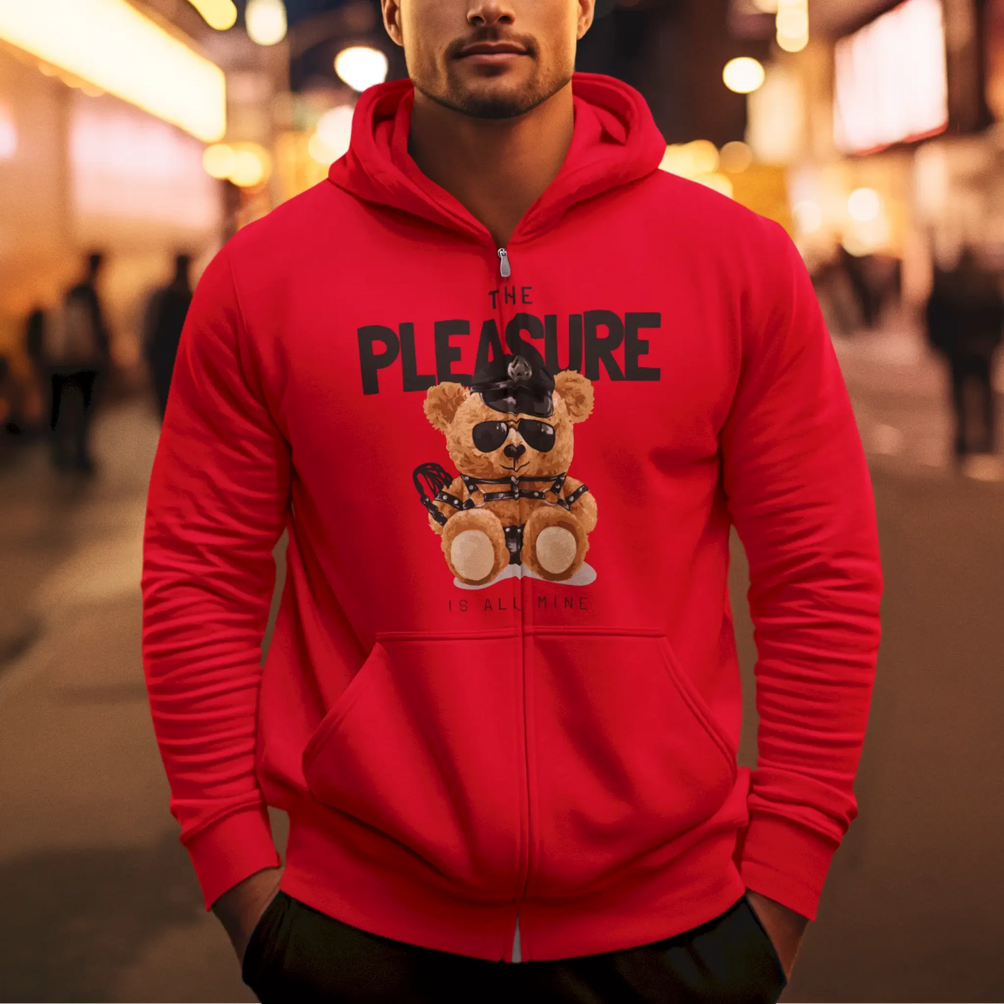 Pleasure teddy in leather harness on red zip up hoodie – Pleasure teddy με leather harness σε κόκκινη ζακέτα με φερμουάρ.