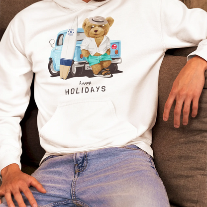 White hoodie with teddy leaning on beach van and holding surfboard – Λευκό hoodie με αρκουδάκι σε χαλάρωση δίπλα σε beach van.