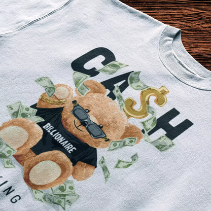 White t-shirt with a gold-detailed bear holding stacks of bills, exuding elite vibes - Λευκό t-shirt με χρυσές λεπτομέρειες και αρκούδο που κρατά δεσμίδες χρημάτων, αποπνέει exclusive αύρα