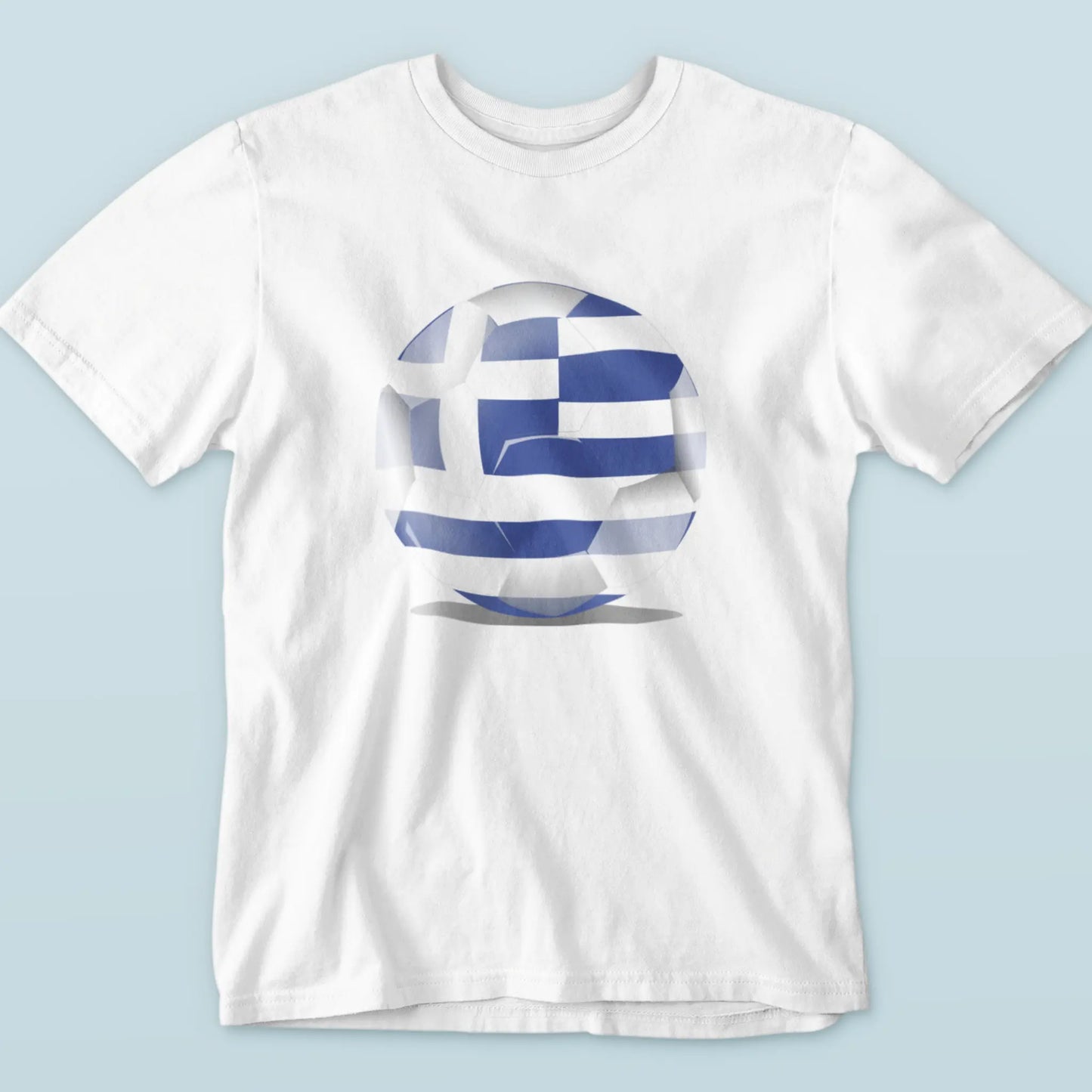 White tee with Greece-themed football ball, ideal for Euro match days – Λευκή μπλούζα με θέμα μπάλα Ελλάδας, ιδανική για μέρες αγώνα.